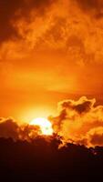 The sun is setting behind a cloud covered sky video