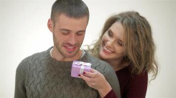 Joyful woman surprises her boyfriend with a gift video