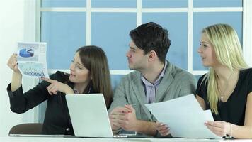 Smiling businessman and project manager engaged in a lively report discussion video