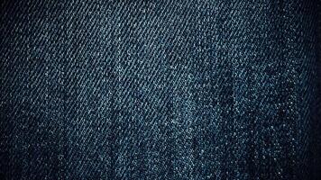 Stylish dark blue denim texture. Looping stop-motion effect animation. video