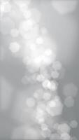 Grayscale bokeh abstract background animation with gently flickering defocused bokeh light hexagons. This elegant atmospheric vertical motion background is full HD and a seamless loop. video