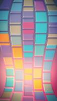 Colorful vibrant shiny background with a gently moving mosaic pattern of glossy tile shapes. This fun multicolored vertical background animation is full HD and a seamless loop. video