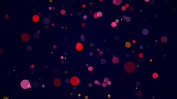 Abstract particle background with shiny colorful sphere particles. This vibrant glowing multicolored background animation is full HD and looping. video