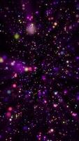Abstract particle background with glittering shiny colorful particles and shimmering light beams. This sparkling multicolored vertical background animation is full HD and a loop. video