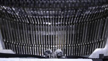 Typo keys of a qwerty typewriter hitting and writing video