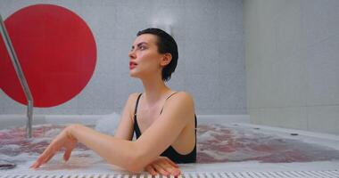 Pretty Brunette Woman Enjoying SPA, Relaxing In Jacuzzi, Relax And Pleasure In SPA Center, Portrait video