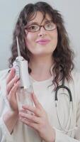 Dentist explains how an irrigator improves oral hygiene and what to consider when using it for best results. video