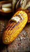 Grilled Corn on the Cob with Melting Butter on Rustic Wood Table - Perfect for Summer BBQ Design photo