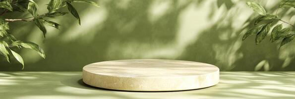 A round marble table sitting in front of green plants photo