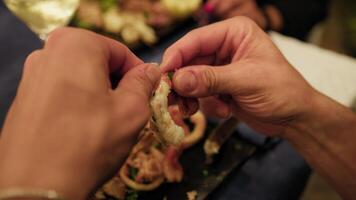 Man Using His Hands To Clean Shrimp Before Eating It video
