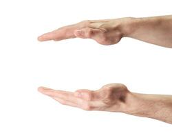 Two hands are holding something out in front of them photo
