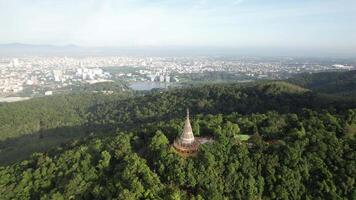 An aerial view of a pagoda in the middle of a forest video