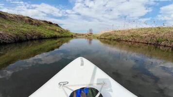 A kayak is seen in the water on a river video