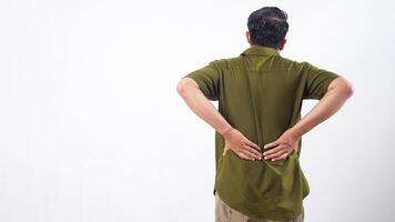Rear view of man suffering from back ache and pain isolated on white background photo