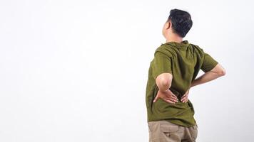 Rear view of man holding his lower back due to back pain isolated on white background photo