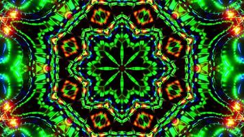 Red and green flower with black background and red center. Kaleidoscope VJ loop video
