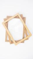 Simple wood picture frame isolated on white background photo