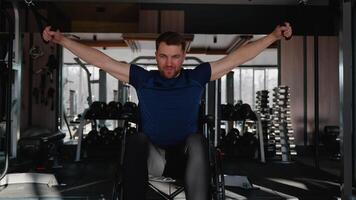 Wheelchair user training back with lat pulldown machine video