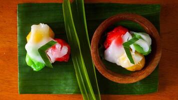 A beautiful and delicious traditional Indonesian snack called Kue Putri Mandi isolated on white background photo