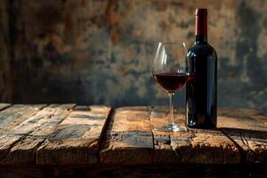 Red wine and a glass of wine on an old wooden table. Front view with copy space and product space. With copy space for your text. Background design, menu, product advertising. photo