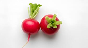 Fresh red radish with green leaves isolated on white background with shadow for healthy eating visuals. Organic whole radish on clean white background for vegan and vegetarian food concepts photo