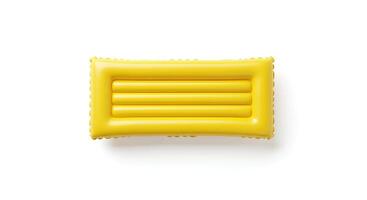 yellow Bright inflatable pool float on white background for beach vacations, swimming and summertime joy photo