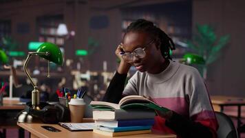 Exhausted student falling asleep while she reads for periodical exams at the college, working hard for diploma with excellent marks. Tired pupil studying all night before first grade. Camera A. video