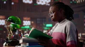 Female pupil struggling to stay focused and awake while researching, writing on her bachelor paper at the library in order to obtain her university diploma. Complete studies. Camera A. video