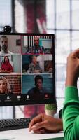Vertical Manager talking to employees during web call at home, analyzing business documents, organizing job tasks. Supervisor doing remote teleconference meeting with staff members. Camera A. video