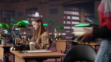 Confident student gathers information and citations from reliable sources via massive database at university library, working on bachelor degree paper. Intelligent girl studies. Camera A. video