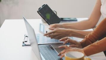 Two people using their laptops at a desk video