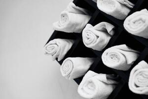 Neatly arranged white towels in a spa setting create a calming atmosphere photo