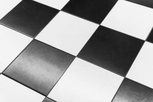 Black and white checkerboard pattern on a polished surface photo