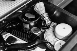 Shaving tools and grooming products neatly arranged in a drawer photo
