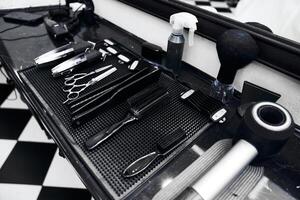 Tools of the trade arranged neatly on a barber shop counter photo