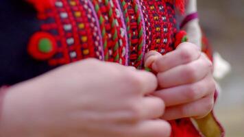 Woman button up on ukrainian traditional costume, photo
