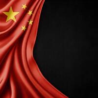 Draped Chinese flag with a prominent large yellow star alongside four smaller ones on the left side. The flag's red silk fabric creates elegant folds photo
