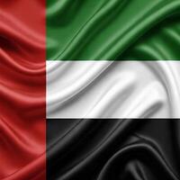 UAE FLAG with a vertical red stripe on the left and three horizontal stripes in green, white, and black. The flag is draped, creating a wavy texture in the fabric photo