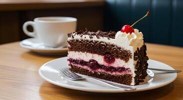 Delicious black forest cake slice with a cup of coffee on wooden table photo