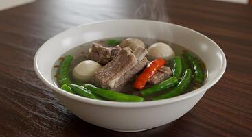 Delightful rendering of sinigang, a traditional Filipino soup dish photo