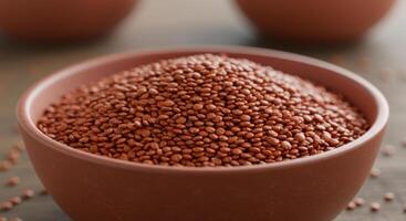 A rustic bowl overflowing with red lentils, ready for a wholesome and nutritious meal. photo