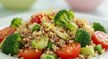 A beautifully presented and nutritious quinoa salad, bursting with fresh, colorful vegetables. photo