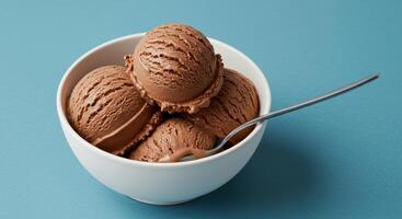 A white bowl brimming with scoops of delicious chocolate ice cream. . photo