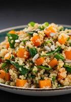 A colorful and nutritious quinoa salad with roasted butternut squash and spinach. photo