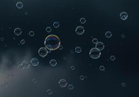 Numerous translucent bubbles float in the air with reflections of light and color. photo