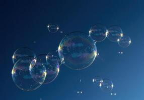 A collection of shimmering bubbles floats gently in the sky, with colorful reflections. photo
