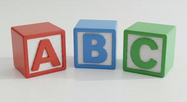 Colorful alphabet blocks arranged in order against a white surface, perfect for educational use. photo