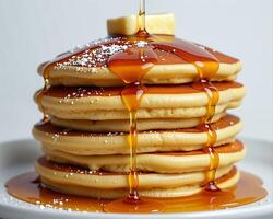 Fluffy Pancakes Stacked High with Maple Syrup and Butter Drizzle photo