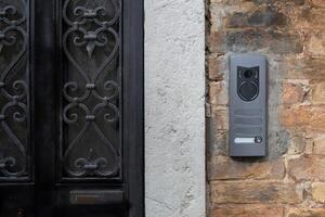 Modern Intercom Panel on Brick Wall photo