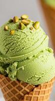 Delightful scoops of green pistachio ice cream in a crispy waffle cone with toppings. photo